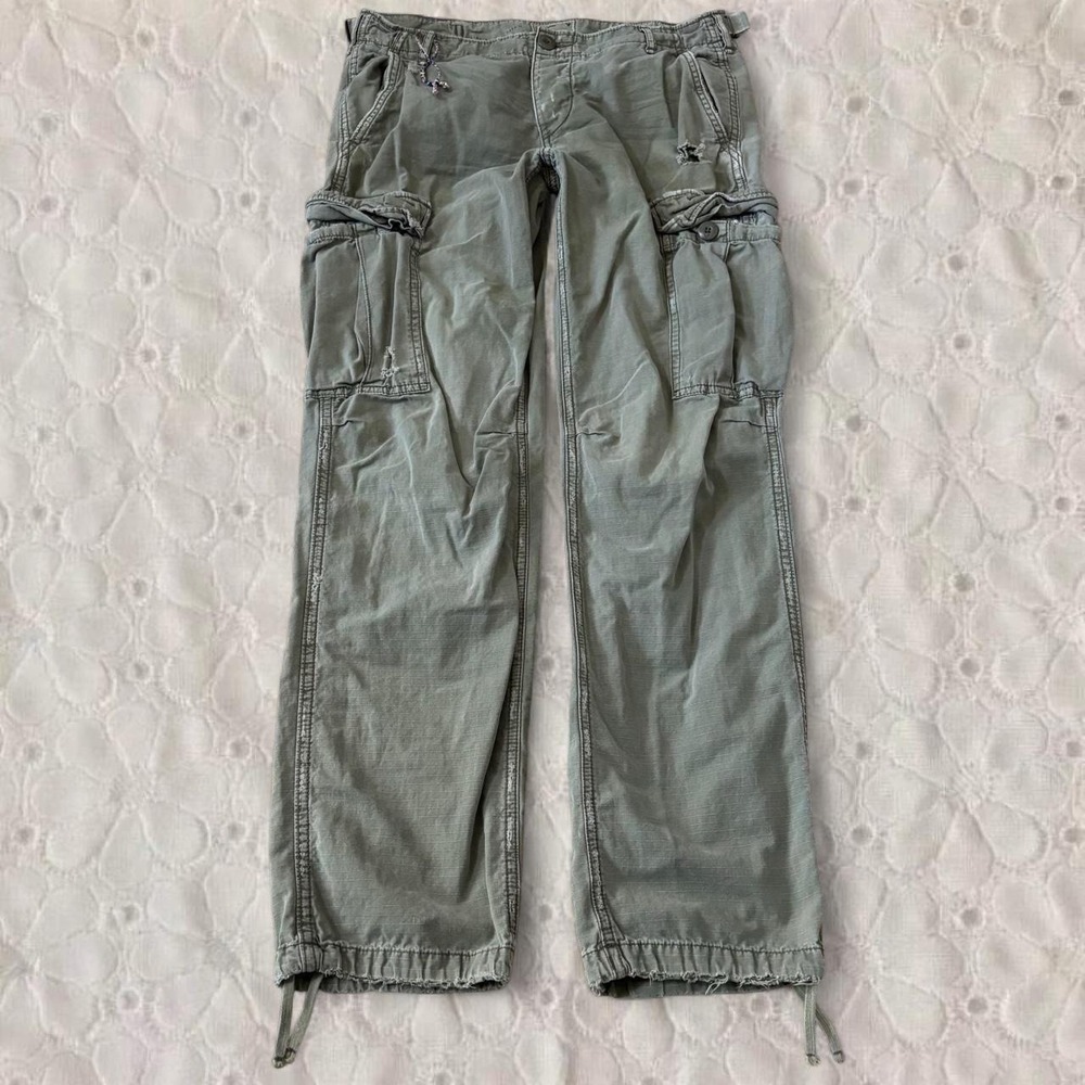 Old American green cargo pants with adjustable waist and ankles